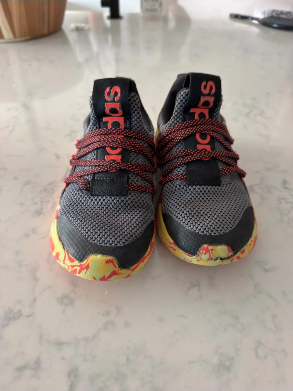 adidas Kids Gray Sneaker with Red Accents and Yellow-Red Marbled Sole